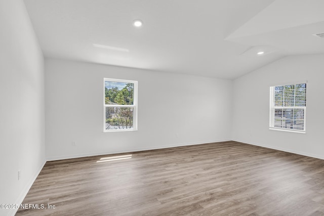 37322 Whisper Way, Hilliard, FL 32046 - spare room with recessed lighting, lofted ceiling, wood finished floors, and baseboards