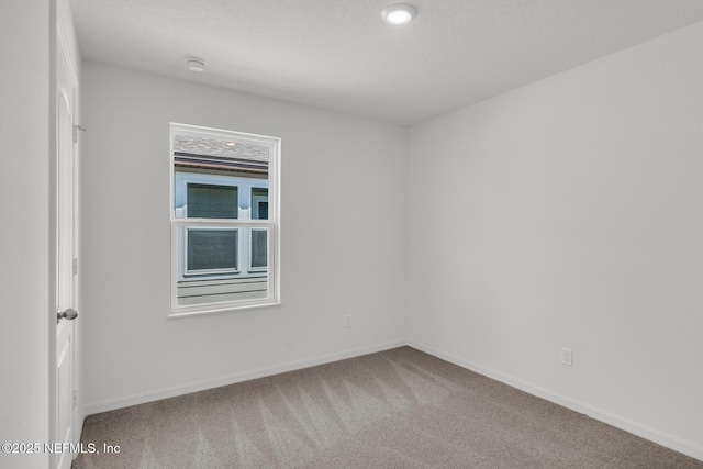 37127 Whippoorwill Ct, Hilliard, FL 32046 - carpeted spare room with baseboards and a smoke detector