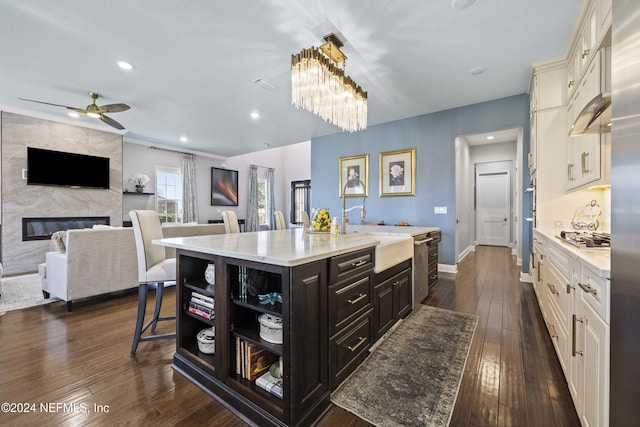 228 Rum Runner Way, Saint Johns, FL 32259 - kitchen with a sink, an island with sink, a breakfast bar, open floor plan, and open shelves