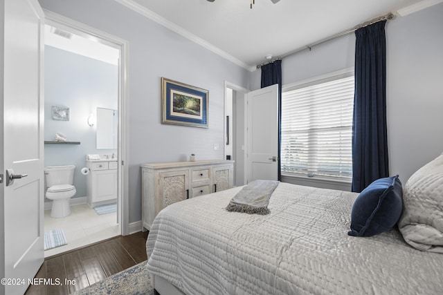 228 Rum Runner Way, Saint Johns, FL 32259 - bedroom featuring ornamental molding, dark wood-type flooring, ensuite bath, and baseboards
