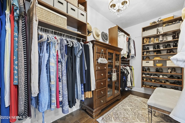 228 Rum Runner Way, Saint Johns, FL 32259 - walk in closet featuring dark wood-type flooring and a chandelier
