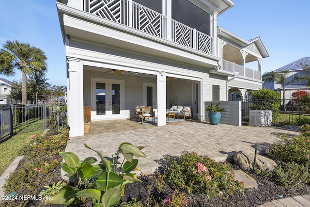228 Rum Runner Way, Saint Johns, FL 32259 - back of property with a balcony, french doors, a fenced backyard, outdoor lounge area, and a patio area