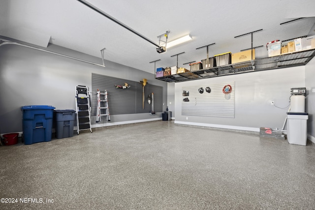 228 Rum Runner Way, Saint Johns, FL 32259 - garage featuring baseboards and a garage door opener