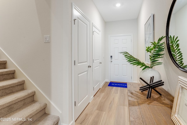 573 Holly Lakes Dr, Orange Park, FL 32073 - entryway with light wood-type flooring, stairs, recessed lighting, and baseboards