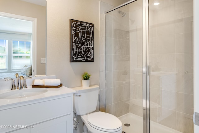 573 Holly Lakes Dr, Orange Park, FL 32073 - ensuite bathroom with a stall shower, vanity, and toilet