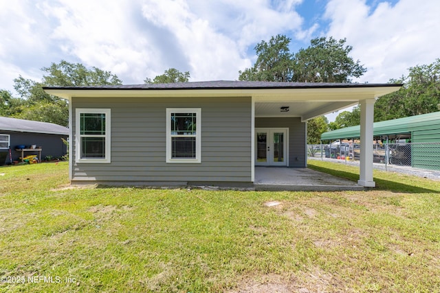 965 Florida St, Fleming Island, FL 32003 - back of house featuring french doors and a lawn