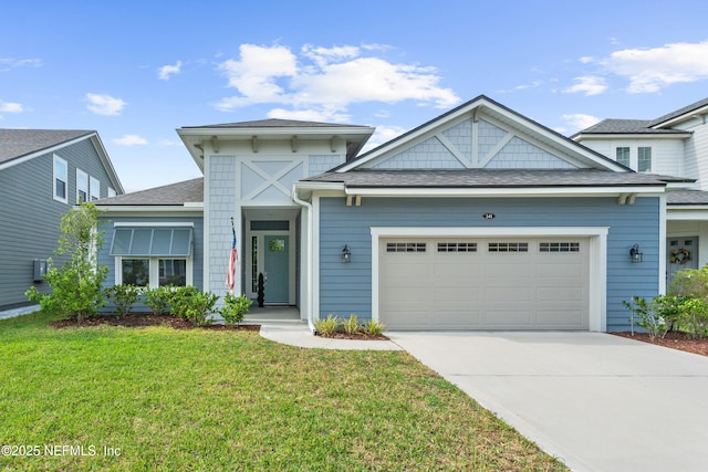 view of front facade with an attached garage, a front yard, driveway, and roof with shingles