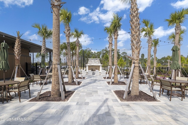 view of home's community featuring a patio and outdoor dining area