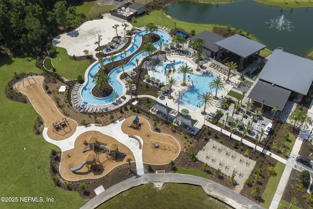 aerial overview of property's location featuring a pool area and a large body of water
