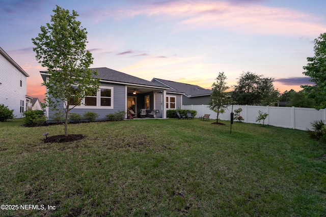 ranch-style house featuring a ceiling fan and a patio