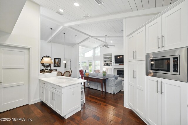 39 Walkers Ridge Dr, Ponte Vedra Beach, FL 32082 - kitchen with stainless steel microwave, a peninsula, white cabinets, ceiling fan, and recessed lighting