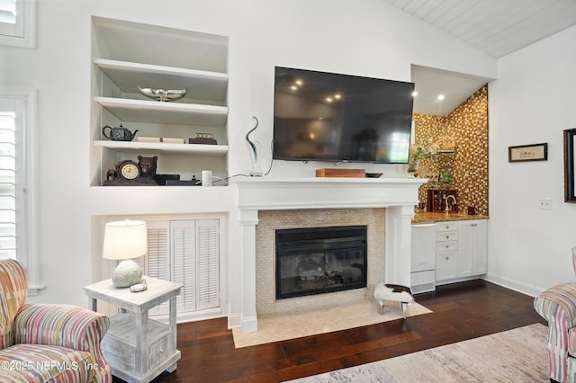 39 Walkers Ridge Dr, Ponte Vedra Beach, FL 32082 - living room featuring vaulted ceiling, hardwood / wood-style flooring, and a tile fireplace