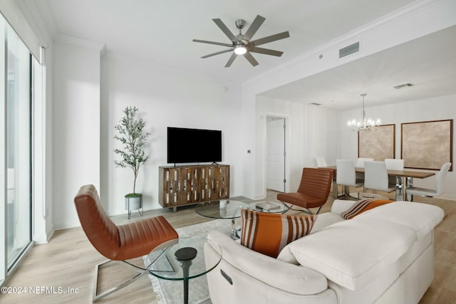living area with light wood-style flooring, a chandelier, crown molding, and a ceiling fan