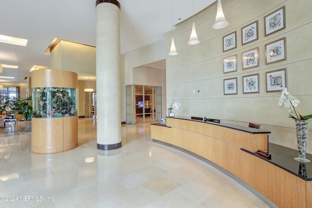 reception with ornate columns and a high ceiling