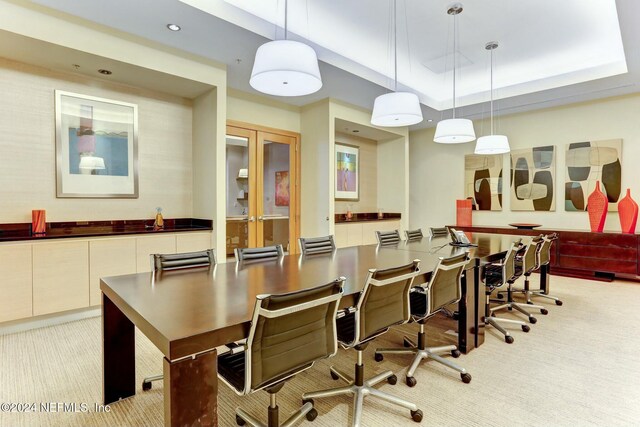 dining room with light colored carpet, recessed lighting, and french doors