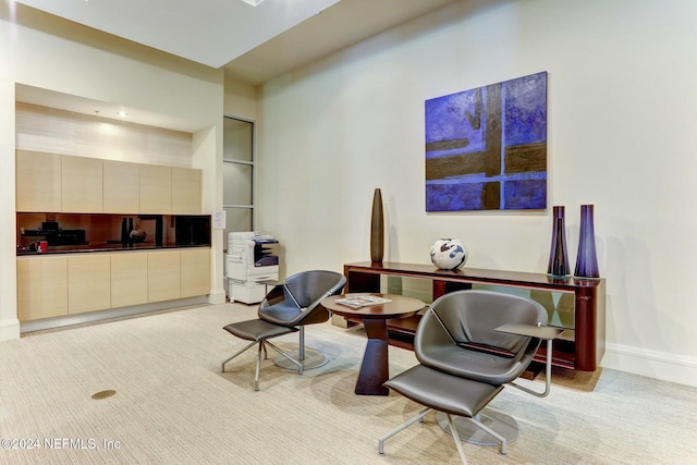 living area featuring baseboards