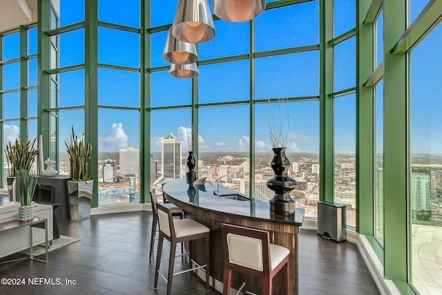 sunroom featuring a city view