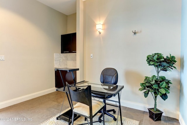 office area featuring tile patterned floors and baseboards