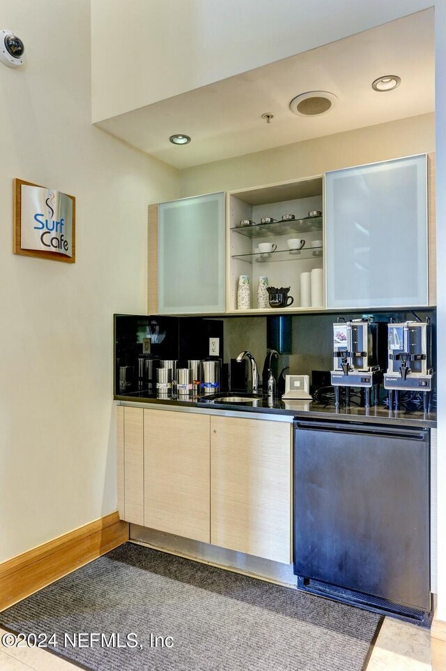 bar area with a sink, fridge, and recessed lighting