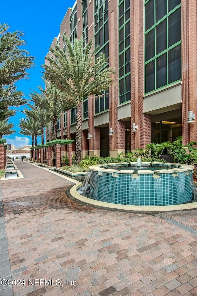 view of swimming pool with central AC unit