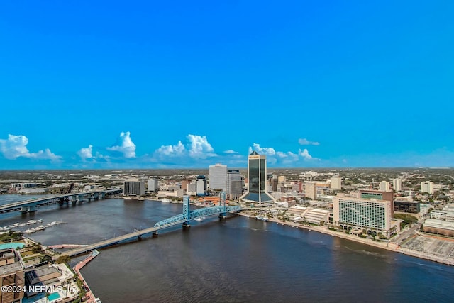view of urban area with a notable bridge and a nearby body of water