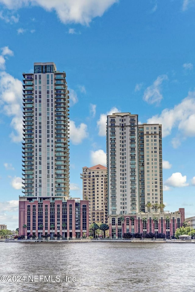 view of urban area featuring a nearby body of water