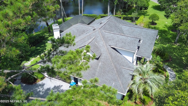 aerial view of property and surrounding area with a large body of water