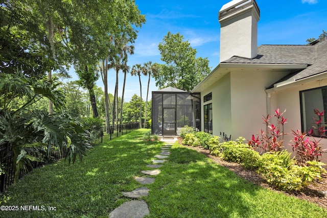 view of yard featuring a lanai