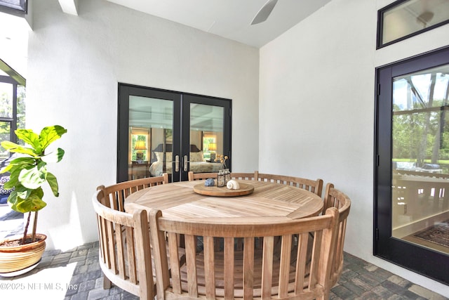 dining area with french doors, plenty of natural light, and a ceiling fan