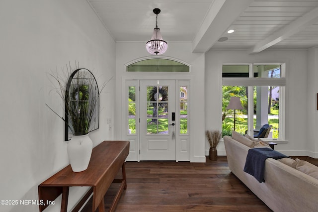 foyer entrance with dark wood-type flooring, a chandelier, recessed lighting, baseboards, and beam ceiling