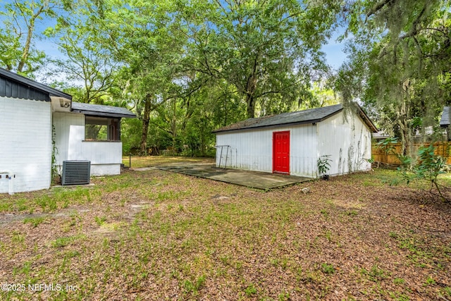 7146 Oakwood Dr, Jacksonville, FL 32211 - view of yard featuring fence, central AC unit, and an outdoor structure