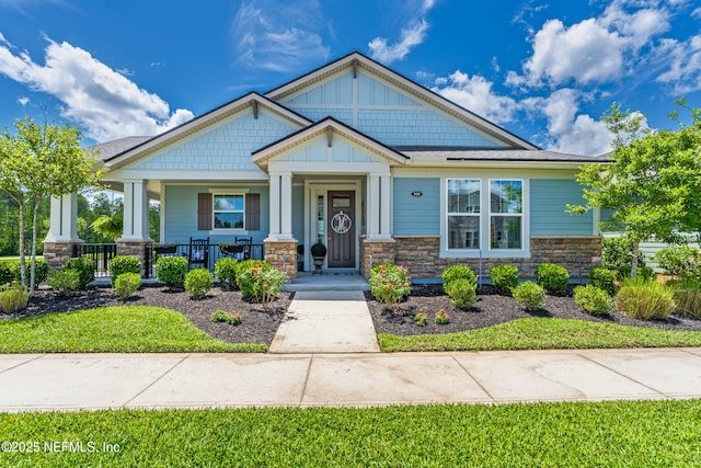 929 Keystone Corners Blvd, Saint Johns, FL 32259 - craftsman inspired home with stone siding, covered porch, and board and batten siding