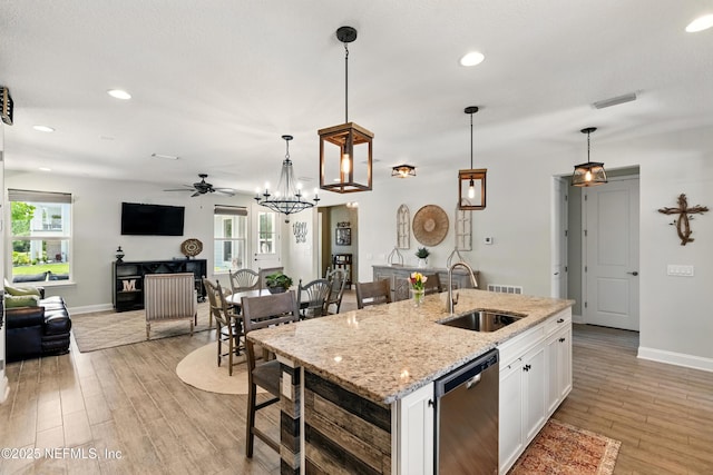 929 Keystone Corners Blvd, Saint Johns, FL 32259 - kitchen with a sink, stainless steel dishwasher, a ceiling fan, open floor plan, and plenty of natural light