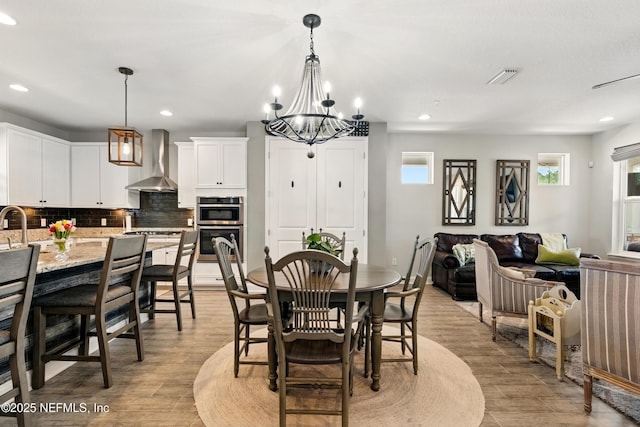 929 Keystone Corners Blvd, Saint Johns, FL 32259 - dining area featuring recessed lighting, a chandelier, and light wood-type flooring