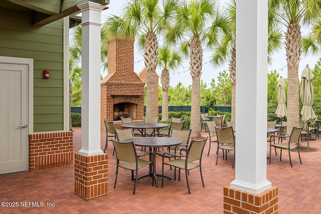 929 Keystone Corners Blvd, Saint Johns, FL 32259 - view of patio / terrace featuring an outdoor brick fireplace and outdoor dining space