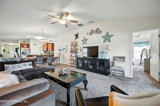 499 Ashby Landing Way, Saint Augustine, FL 32086 - living room with lofted ceiling, a ceiling fan, carpet flooring, a chandelier, and baseboards