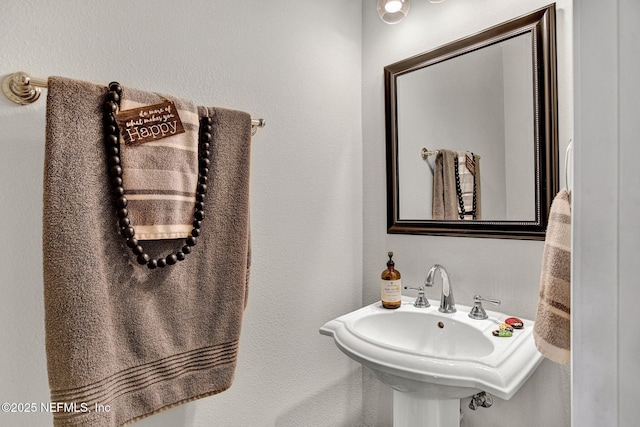 13527 Isla Vista Dr, Jacksonville, FL 32224 - bathroom with a sink, a textured wall, and a towel warmer