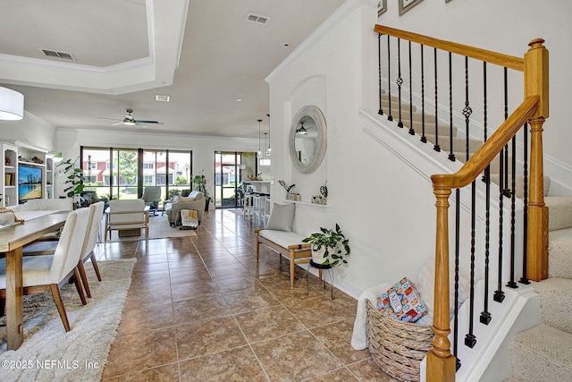 13527 Isla Vista Dr, Jacksonville, FL 32224 - stairs with crown molding, a ceiling fan, and tile patterned floors