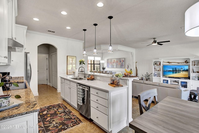 13527 Isla Vista Dr, Jacksonville, FL 32224 - kitchen featuring a sink, appliances with stainless steel finishes, arched walkways, ceiling fan, and white cabinets