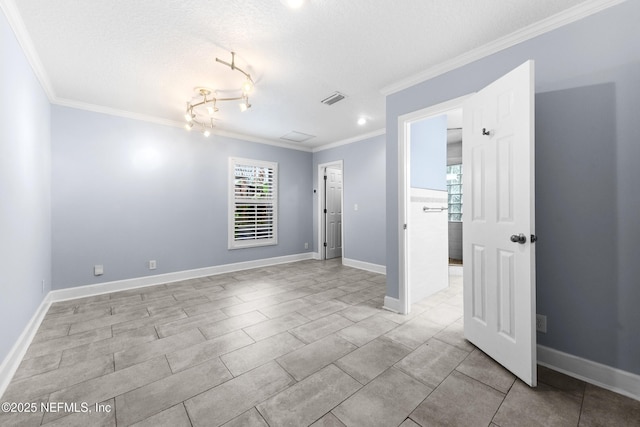 224 Bowles St, Neptune Beach, FL 32266 - spare room with ornamental molding, a textured ceiling, baseboards, and track lighting