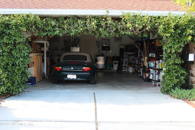 224 Bowles St, Neptune Beach, FL 32266 - garage with water heater and driveway
