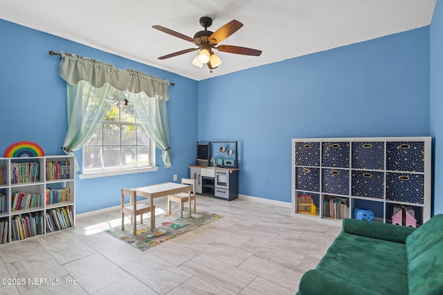 952 Long Lake Dr, Jacksonville, FL 32225 - living area featuring a ceiling fan, a textured ceiling, and baseboards