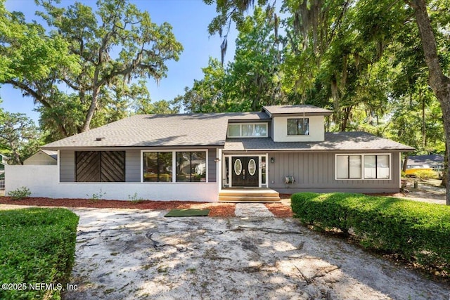 2438 Sylvan Chase Dr, Orange Park, FL 32073 - tri-level home featuring roof with shingles
