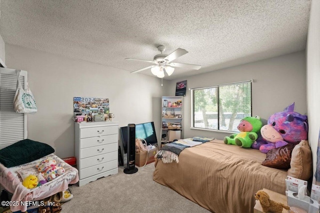 2438 Sylvan Chase Dr, Orange Park, FL 32073 - bedroom with carpet flooring, a ceiling fan, and a textured ceiling