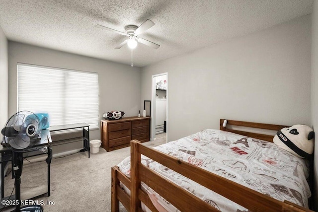 2438 Sylvan Chase Dr, Orange Park, FL 32073 - bedroom with light carpet, ceiling fan, and a textured ceiling