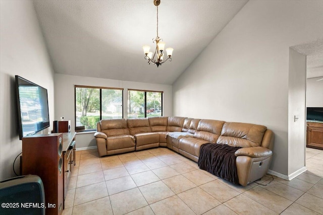 2438 Sylvan Chase Dr, Orange Park, FL 32073 - living room with a chandelier, light tile patterned floors, high vaulted ceiling, and baseboards