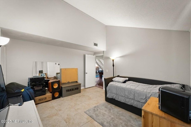 2438 Sylvan Chase Dr, Orange Park, FL 32073 - tiled bedroom featuring high vaulted ceiling