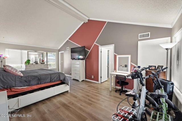 2438 Sylvan Chase Dr, Orange Park, FL 32073 - bedroom with wood finished floors, beamed ceiling, ornamental molding, a textured ceiling, and baseboards