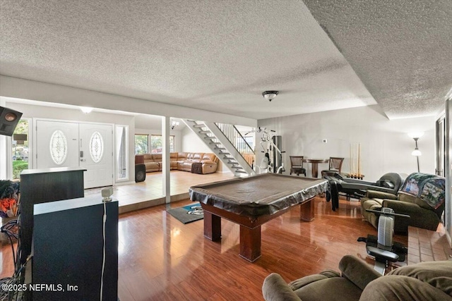 2438 Sylvan Chase Dr, Orange Park, FL 32073 - game room with a textured ceiling, pool table, and wood finished floors