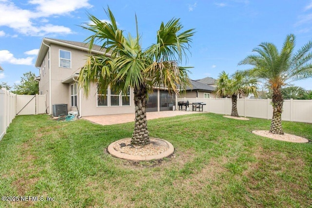 rear view of property featuring a patio area, central AC unit, and stucco siding